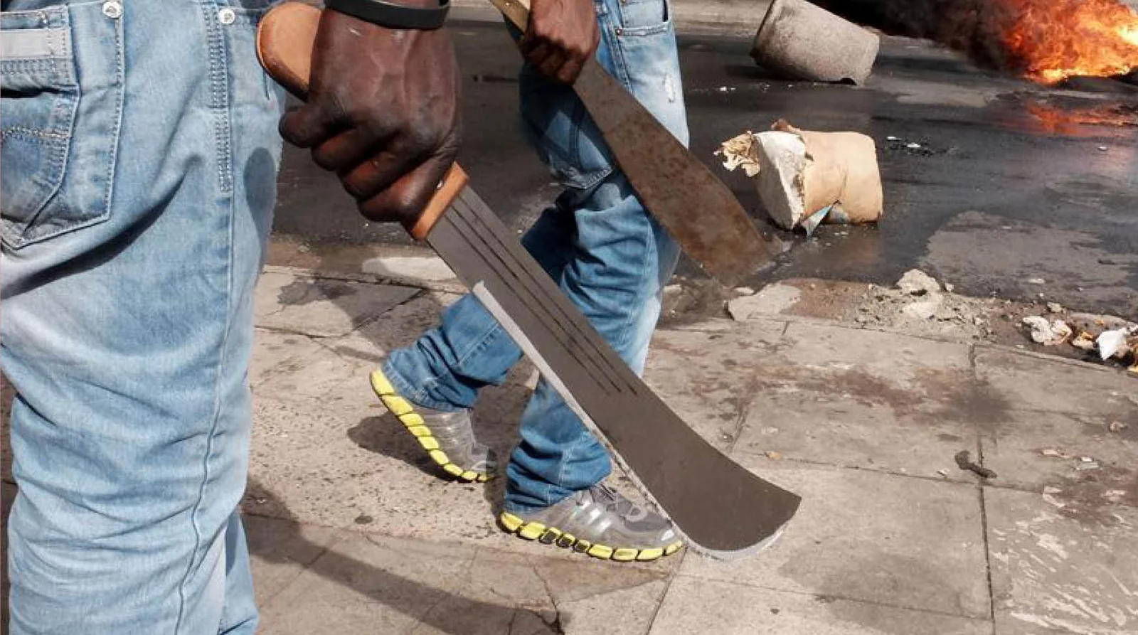 Police launch probe into viral video of masked men wielding machetes